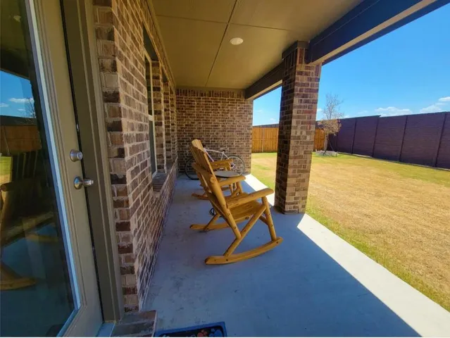 a view of an empty room with a fireplace