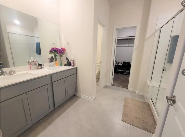 a bathroom with a sink and mirror