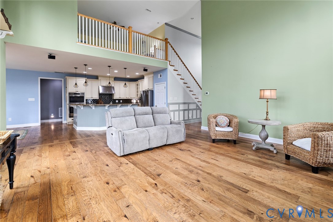 16112 Garston Lane Midlothian, VA 23112 - Photo 12 of 37 a living room with furniture and a dining table