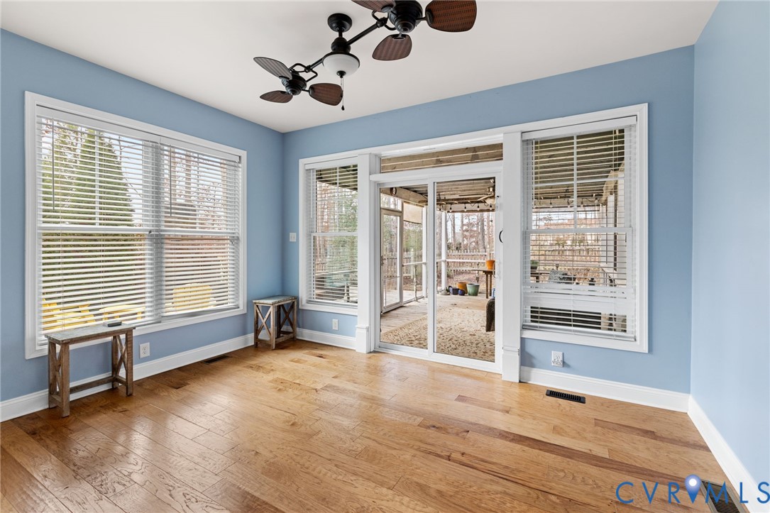 16112 Garston Lane Midlothian, VA 23112 - Photo 18 of 37 a view of an empty room with a window and wooden floor