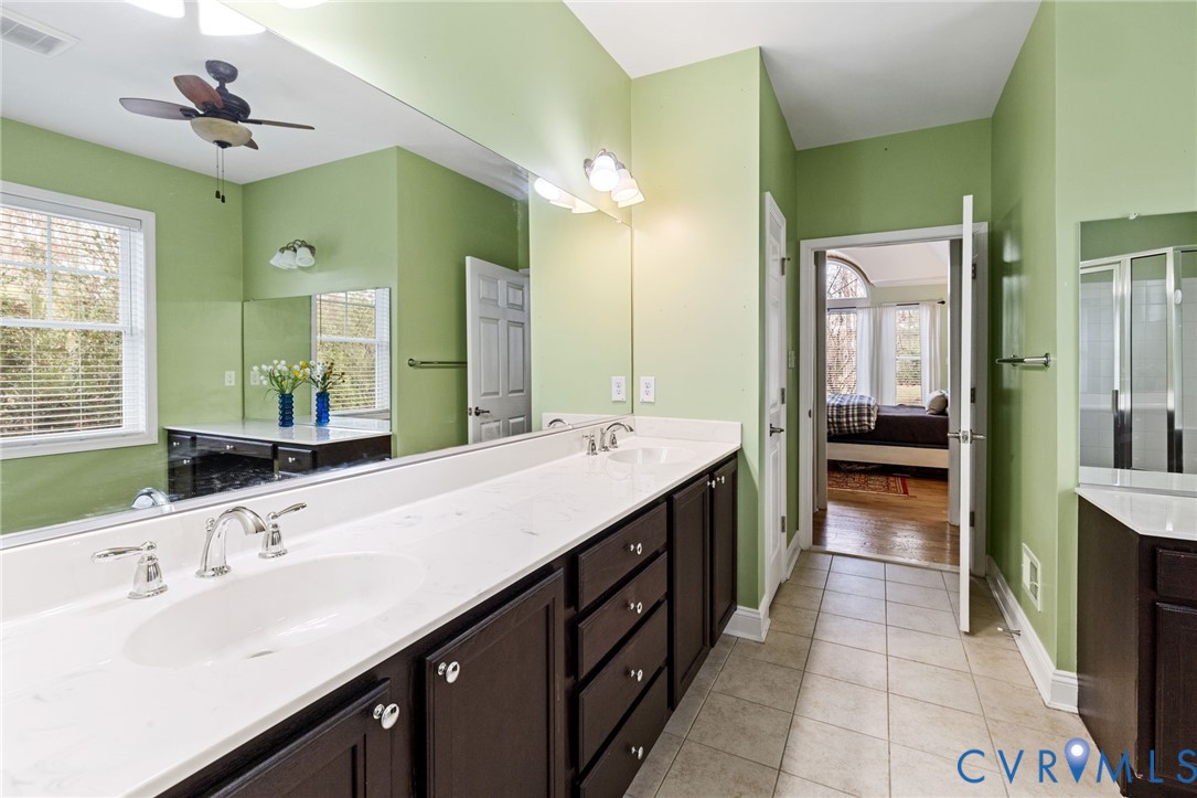 16112 Garston Lane Midlothian, VA 23112 - Photo 23 of 37 a bathroom with a double vanity sink and a mirror