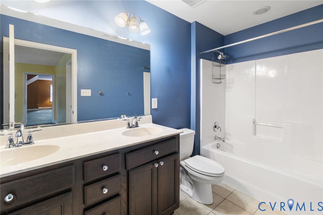 16112 Garston Lane Midlothian, VA 23112 - Photo 26 of 37 a bathroom with a sink a toilet and shower