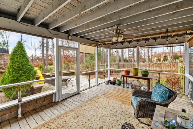 a view of a house with backyard sitting area and garden