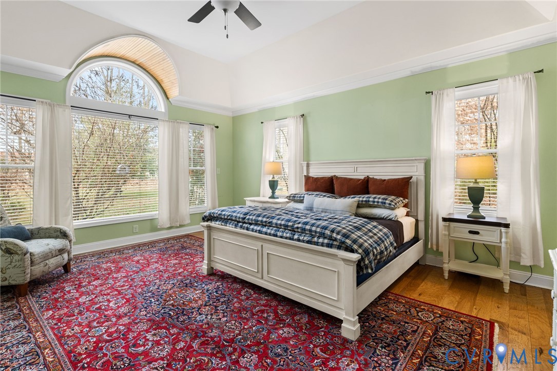 16112 Garston Lane Midlothian, VA 23112 - Photo 4 of 37 a bedroom with a bed and a large window