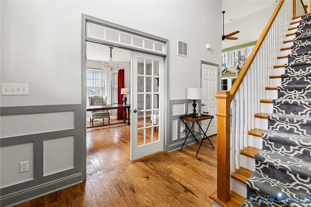 a view of a livingroom with furniture and hardwood floor