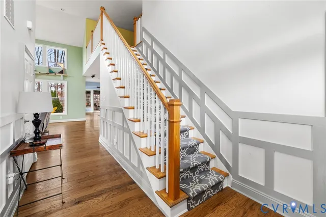 a view of staircase with wooden floor and a potted plant