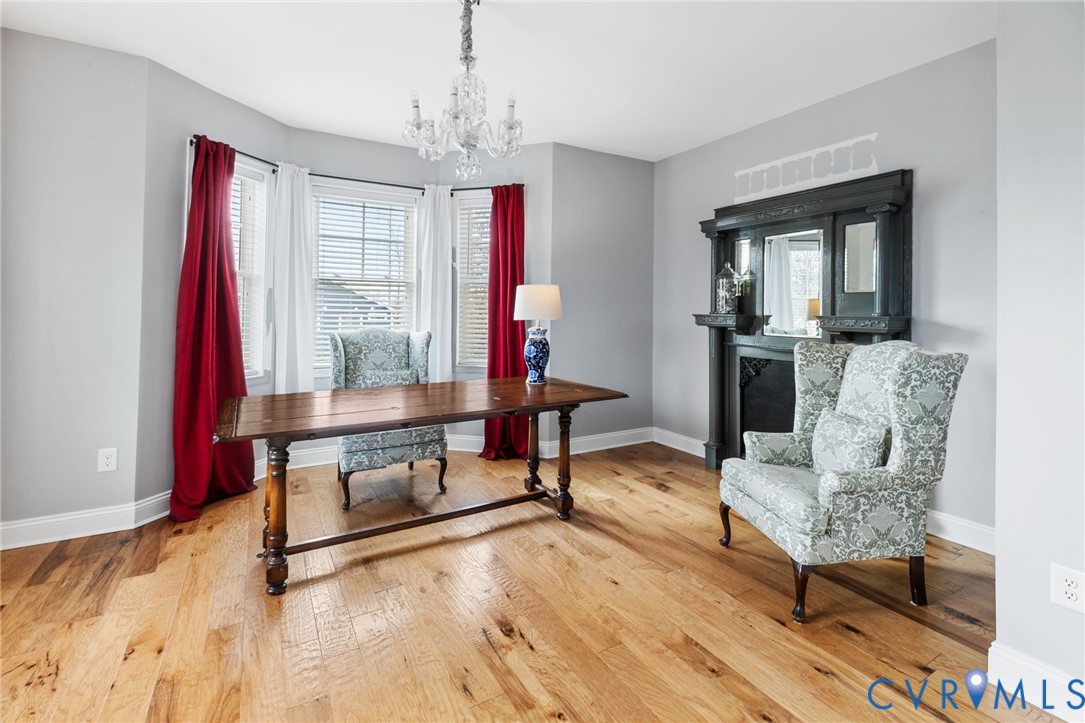16112 Garston Lane Midlothian, VA 23112 - Photo 8 of 37 a living room with furniture and a chandelier