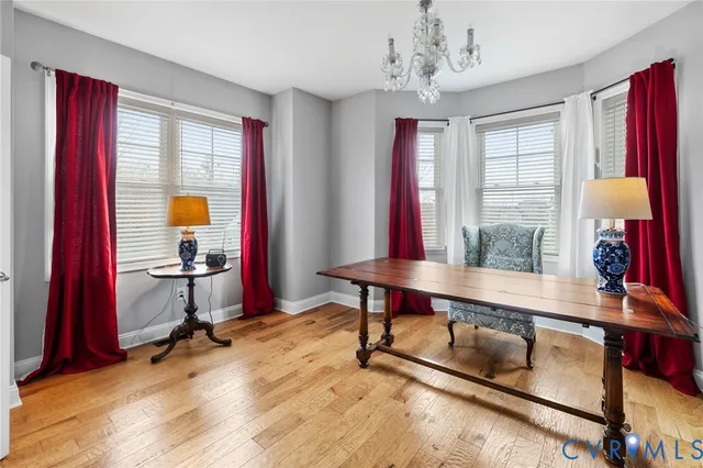 a view of a livingroom with furniture and a window