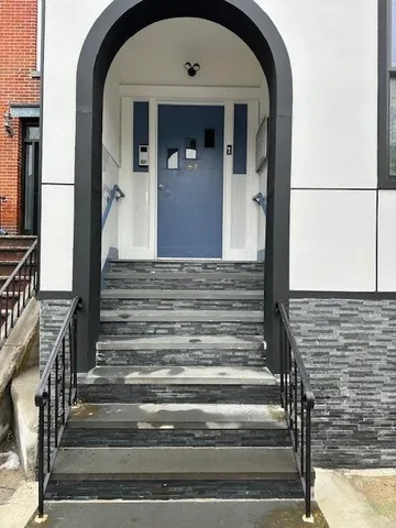 a view of entryway with a front door