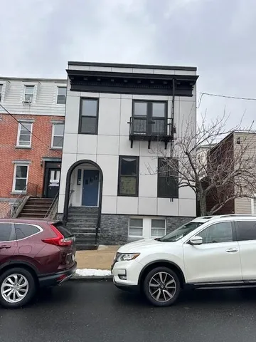 a car parked in front of a house