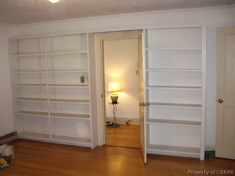 769 Greys Point Road Topping, VA 23169 - Photo 10 of 15 Built-in bookshelves in one of the downstairs bedrooms