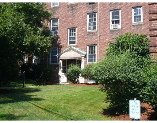 7 Lanark Road, Unit 4 Brookline, MA 02445 - Photo 1 of 1 a front view of a house with a yard