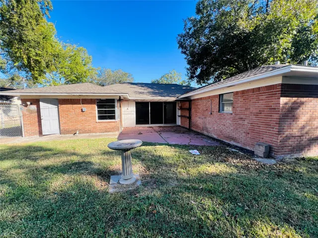 a view of a hall with a staircase