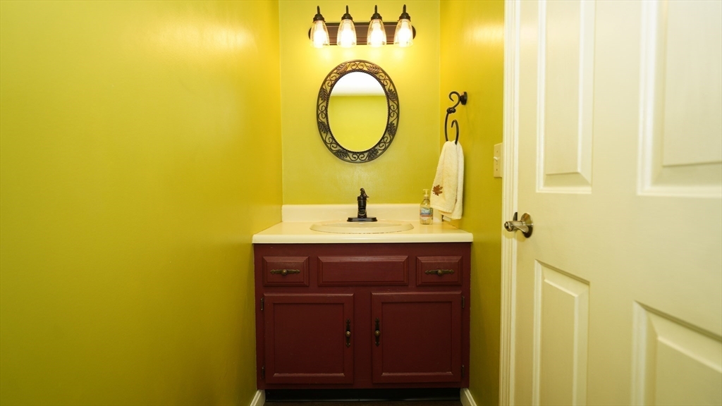 64 Mechanic Street, Unit 3 Attleboro, MA 02703 - Photo 18 of 39 a bathroom with a sink and a mirror
