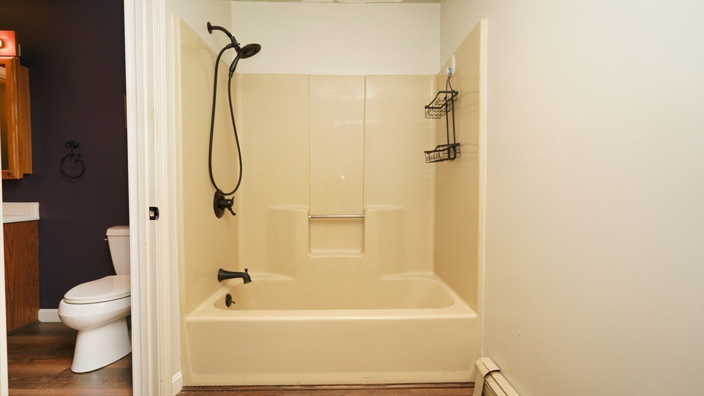 64 Mechanic Street, Unit 3 Attleboro, MA 02703 - Photo 35 of 39 a bathroom with a shower a toilet and a shower