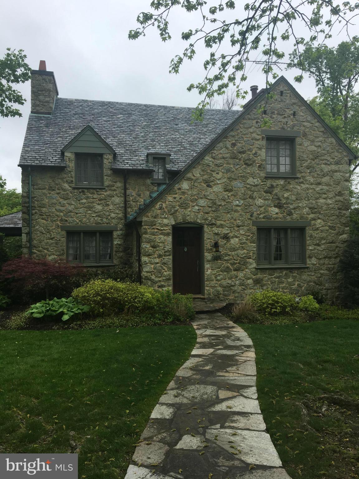 204 Paddington Road Baltimore, MD 21212 - Photo 1 of 1 a front view of a house with a garden