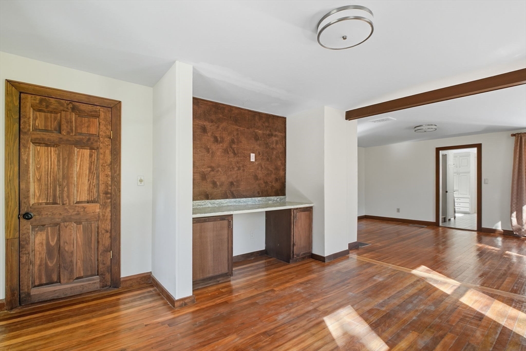 259 Long Plain Road Leverett, MA 01054 - Photo 13 of 39 a view of an empty room with window and wooden floor