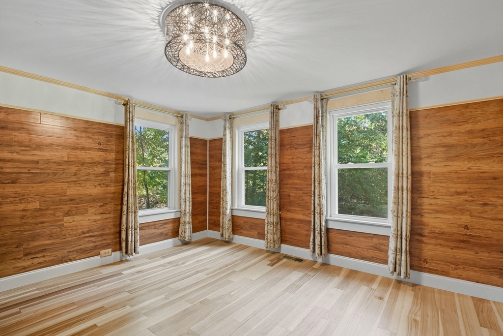 259 Long Plain Road Leverett, MA 01054 - Photo 14 of 39 an empty room with wooden floor and windows