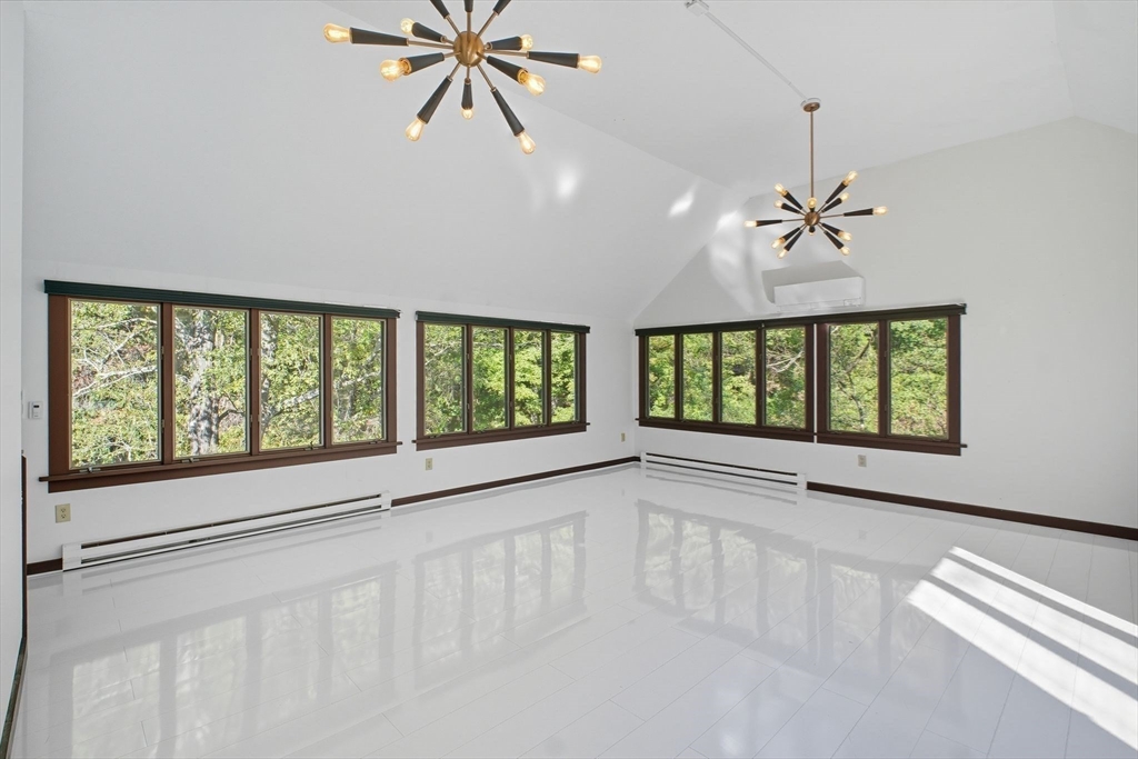 259 Long Plain Road Leverett, MA 01054 - Photo 17 of 39 a view of an empty room with a window