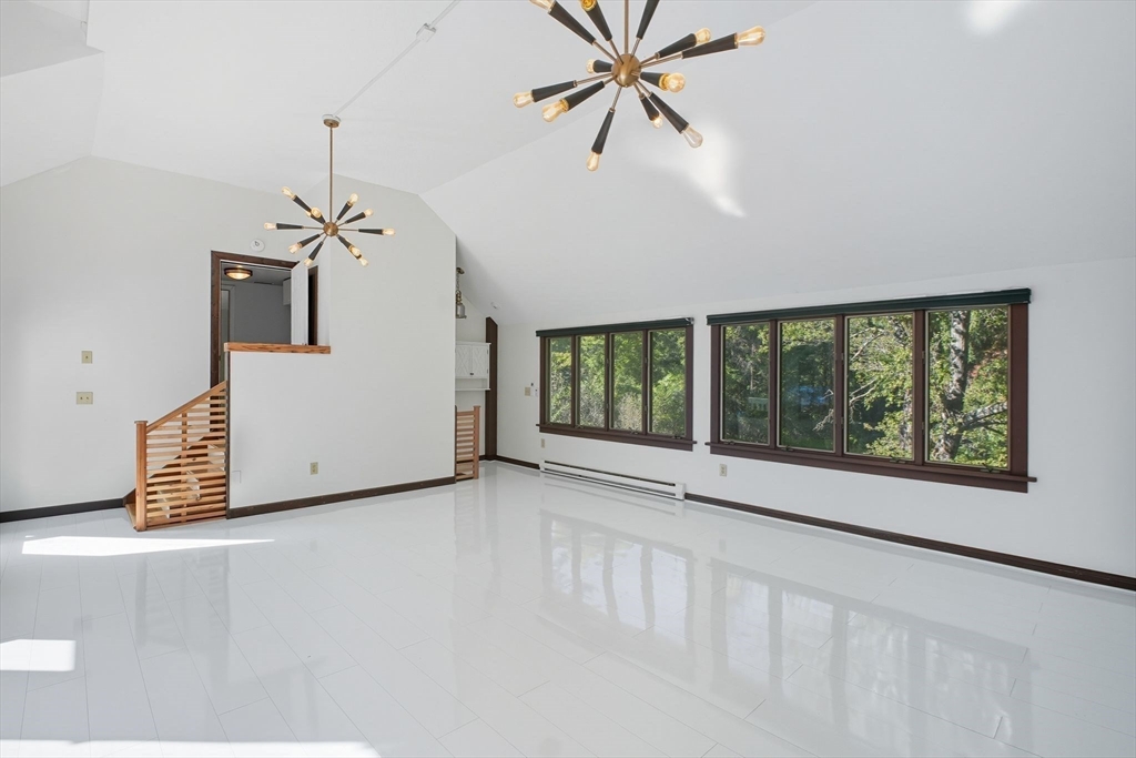 259 Long Plain Road Leverett, MA 01054 - Photo 18 of 39 a view of a livingroom with a ceiling fan and window