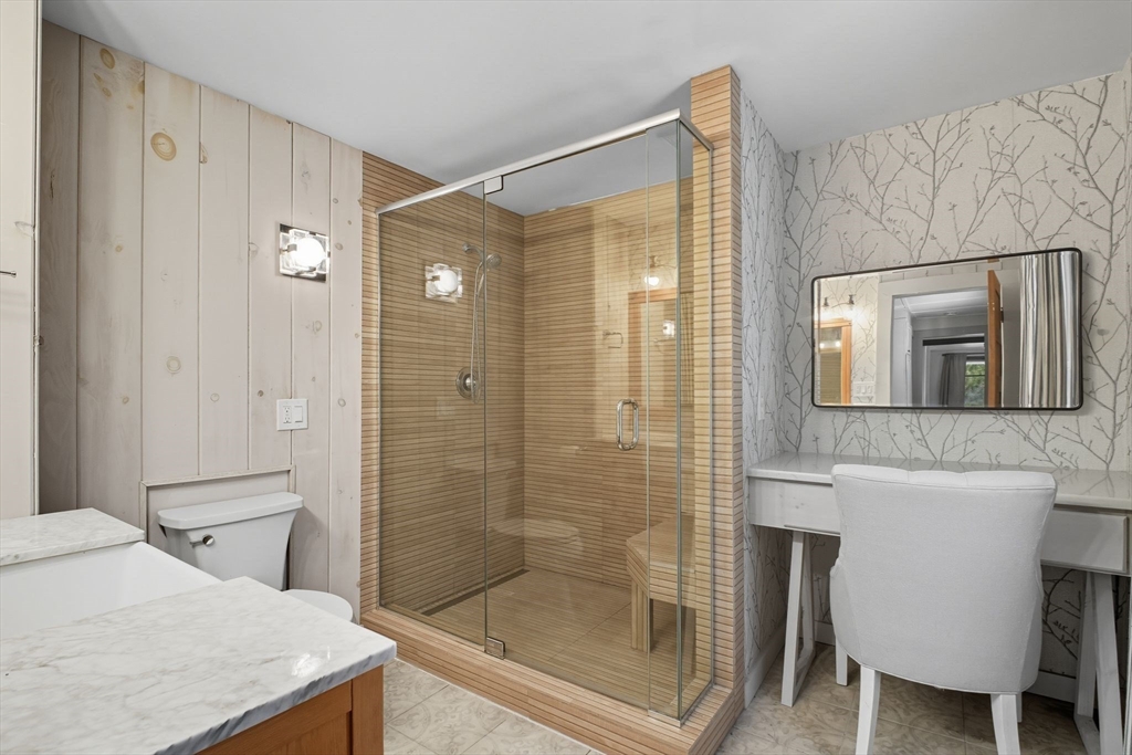 259 Long Plain Road Leverett, MA 01054 - Photo 20 of 39 a bathroom with a granite countertop sink a toilet and shower