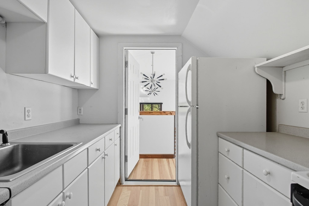 259 Long Plain Road Leverett, MA 01054 - Photo 30 of 39 a kitchen with stainless steel appliances granite countertop a refrigerator and a sink