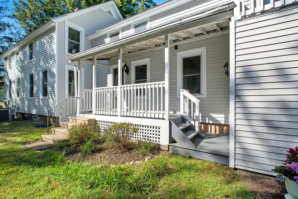 259 Long Plain Road Leverett, MA 01054 - Photo 3 of 39 a view of a house with a small yard and wooden floor and fence