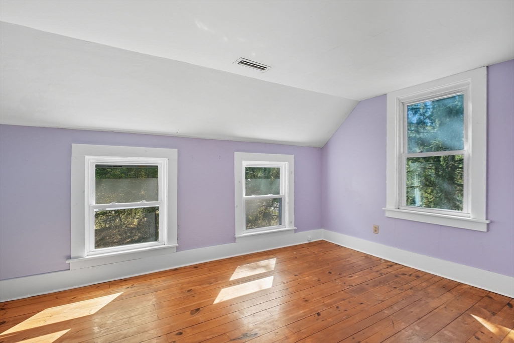 259 Long Plain Road Leverett, MA 01054 - Photo 33 of 39 a view of an empty room with wooden floor and a window