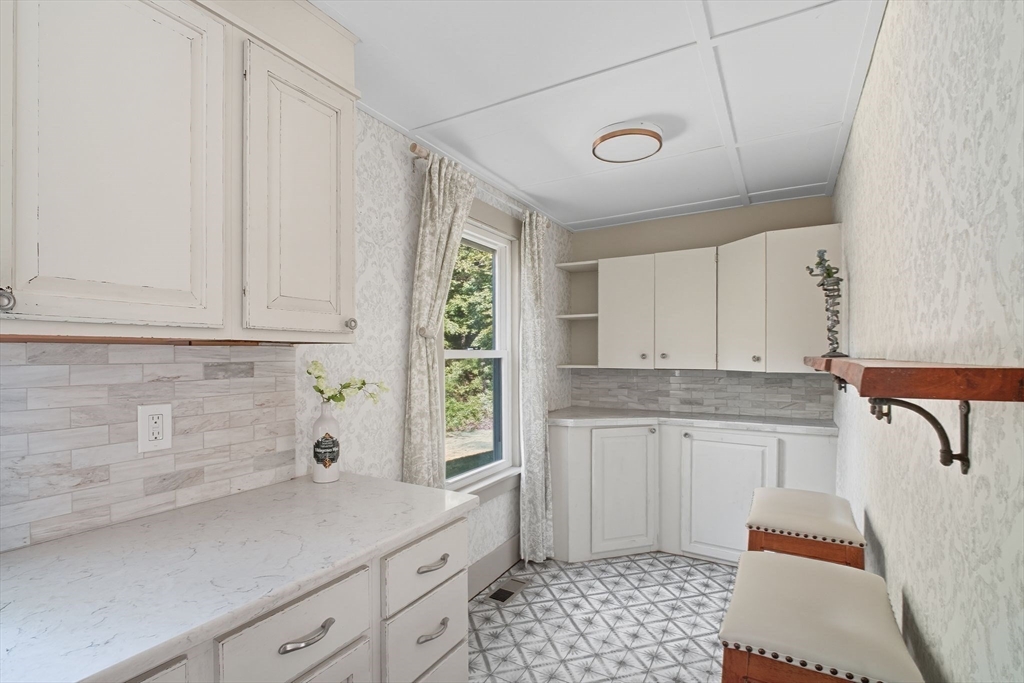 259 Long Plain Road Leverett, MA 01054 - Photo 8 of 39 a kitchen with a sink window and cabinets