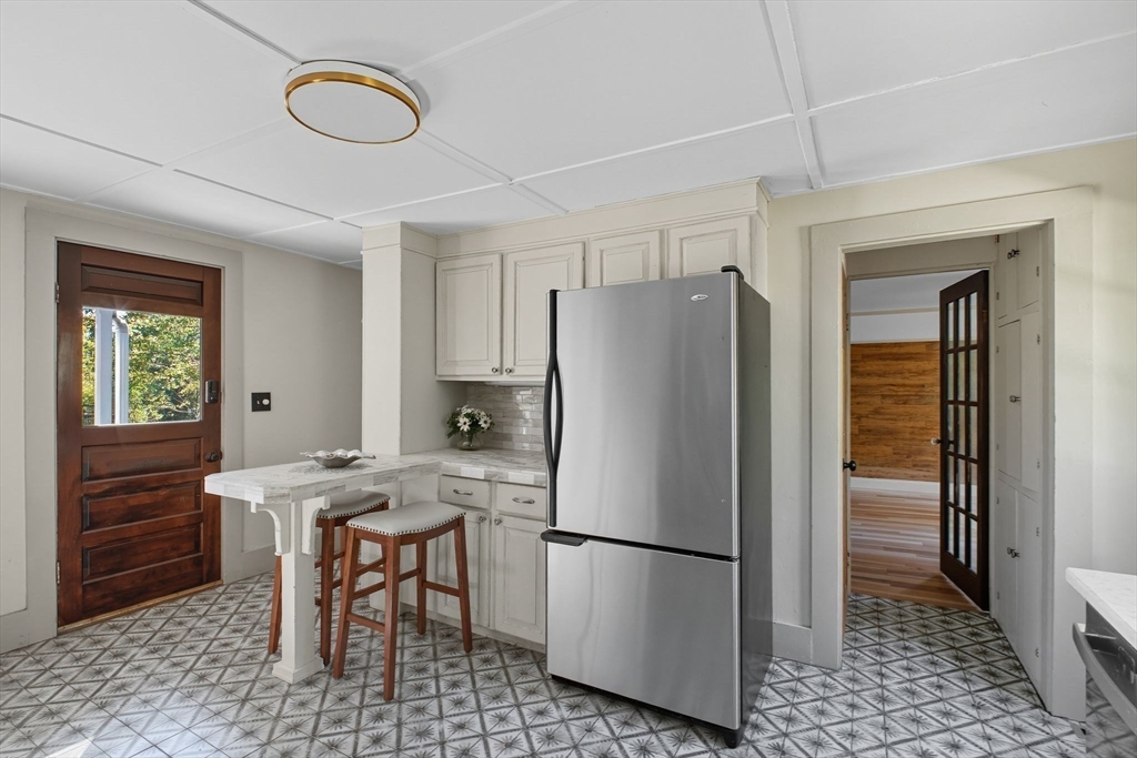 259 Long Plain Road Leverett, MA 01054 - Photo 9 of 39 a white refrigerator freezer and a stove sitting inside of a kitchen