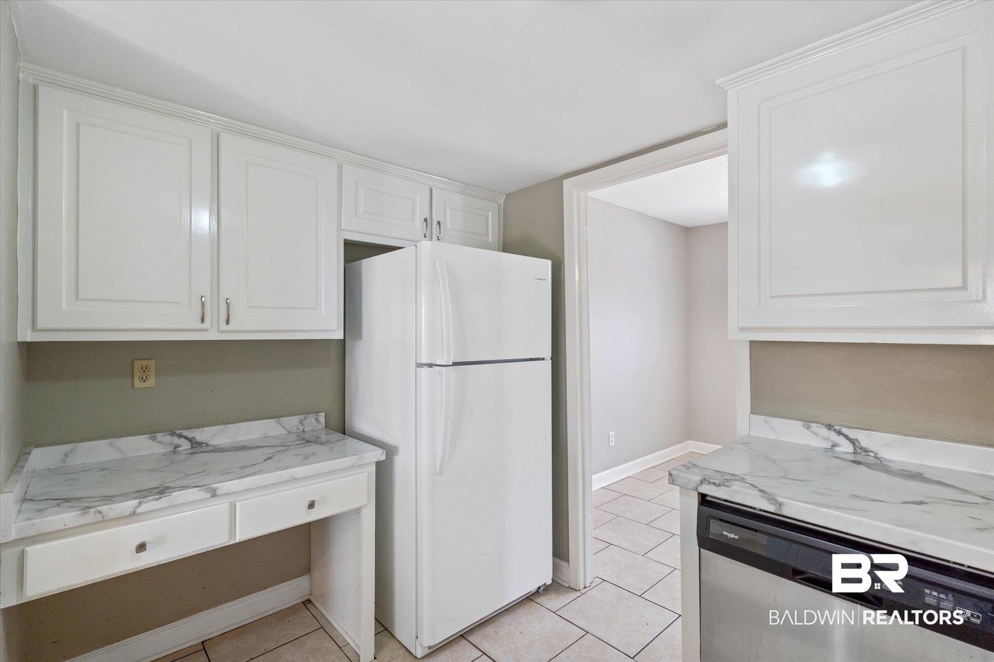 4017 Cottage Hill Road, Unit 59 Mobile, AL 36609 - Photo 7 of 25 Kitchen featuring white refrigerator, white cabinetry, dishwasher, light stone countertops, and light tile patterned flooring