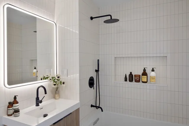 a living room with furniture gym equipment and a window