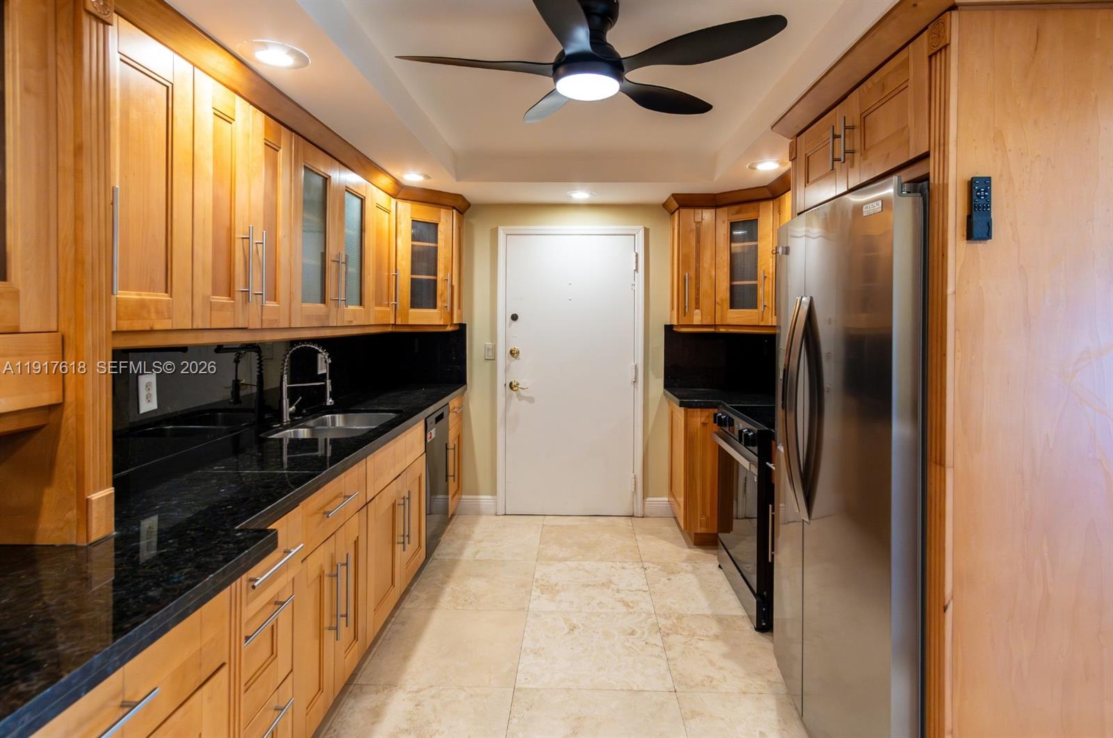 145 Southeast 25th Road, Unit 1003 Miami, FL 33129 - Photo 14 of 43 a kitchen with stainless steel appliances granite countertop a refrigerator and a stove