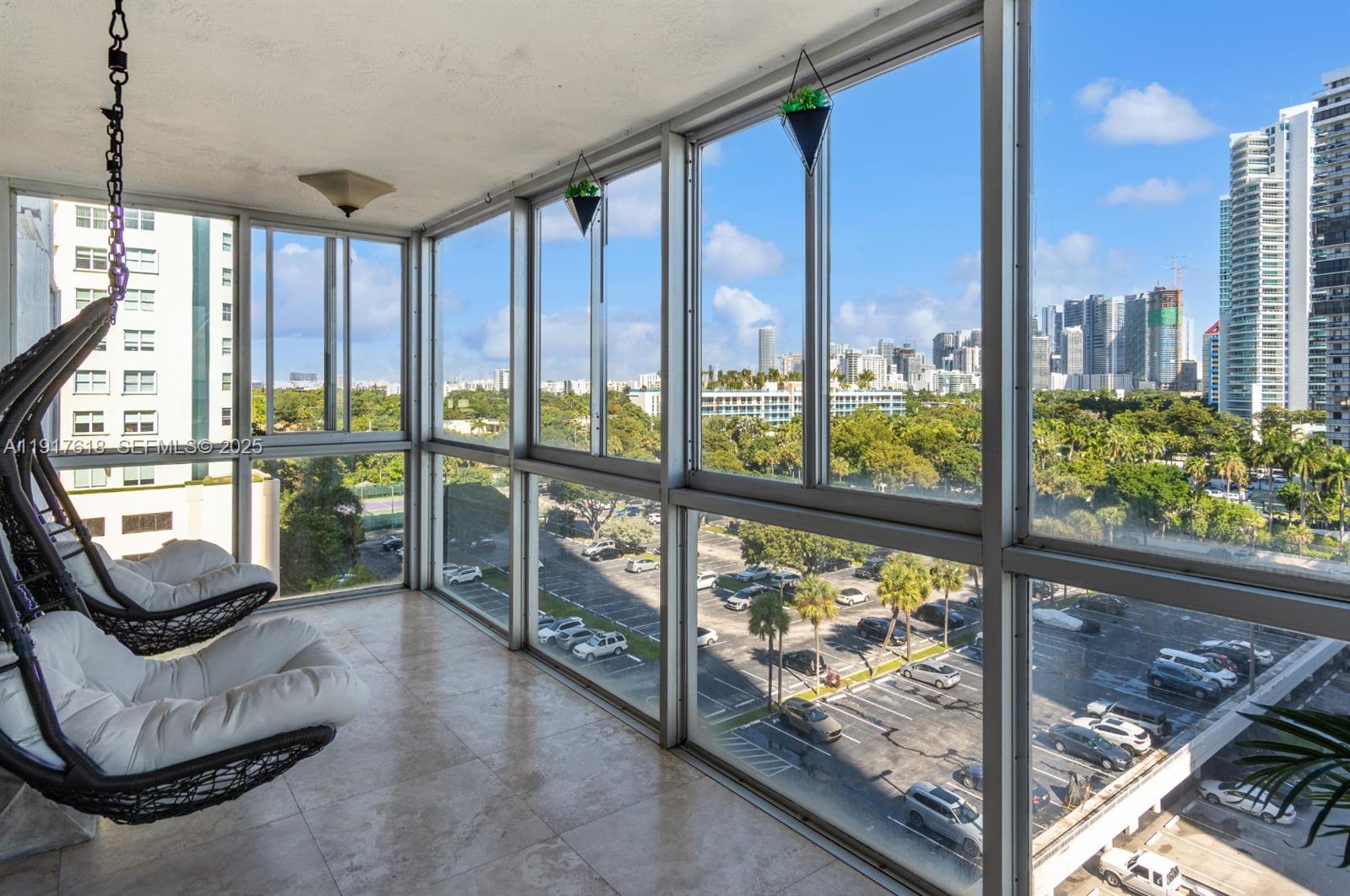 145 Southeast 25th Road, Unit 1003 Miami, FL 33129 - Photo 15 of 43 a view of a living room and floor to ceiling window and an outdoor living room