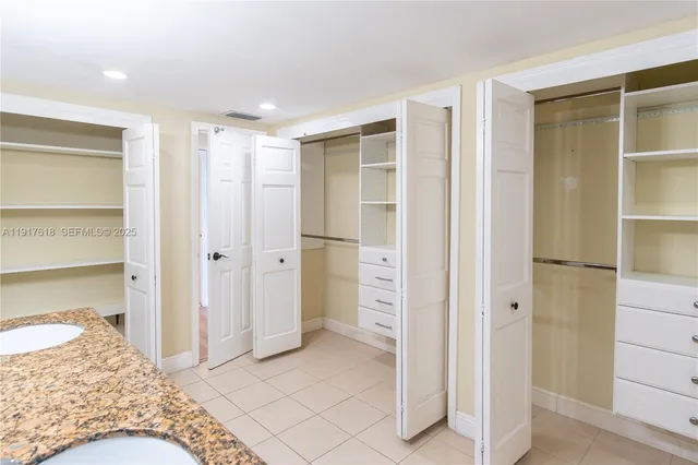 a view of an empty walk in closet