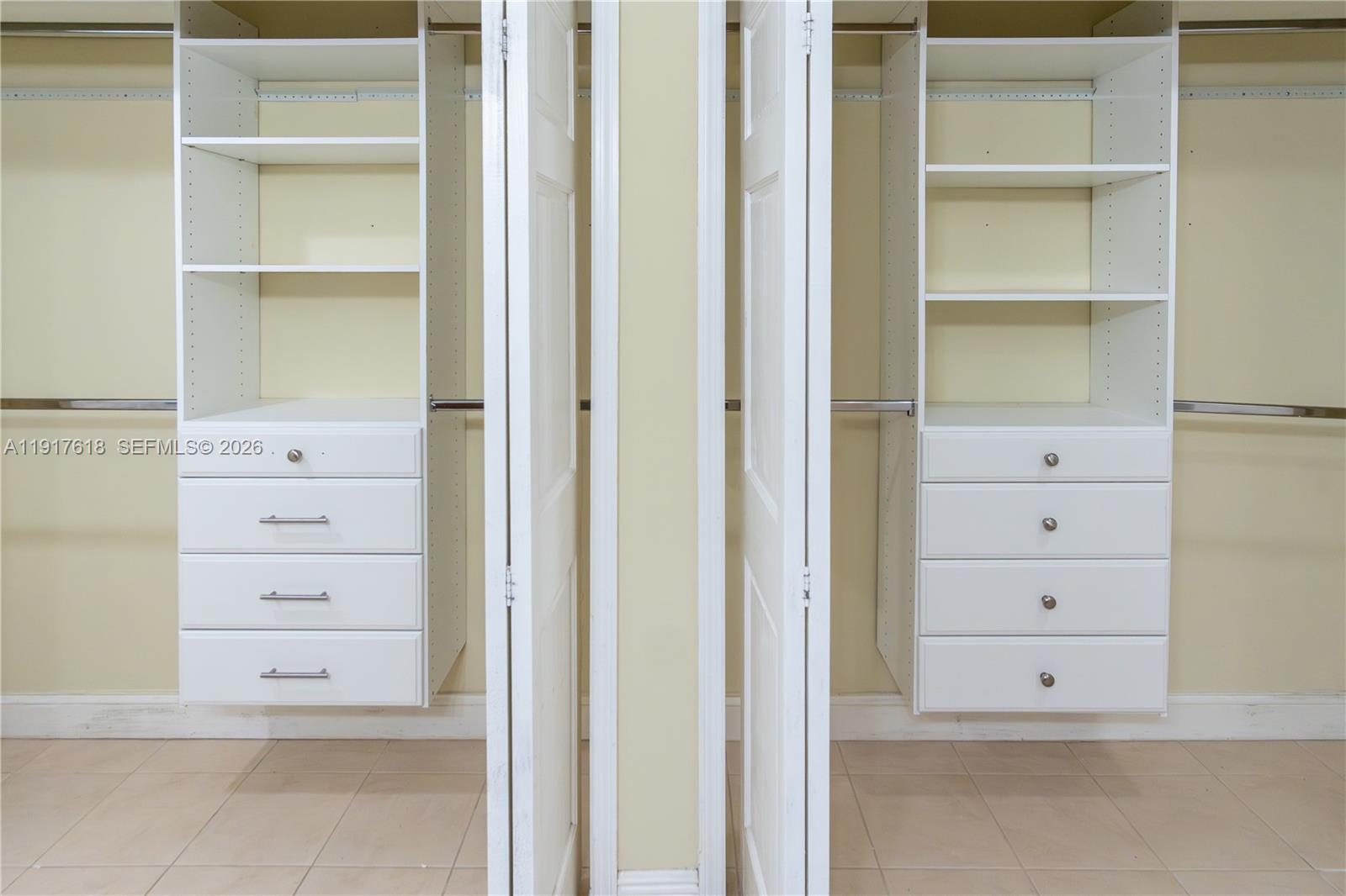 145 Southeast 25th Road, Unit 1003 Miami, FL 33129 - Photo 24 of 43 a view of an empty walk in closet