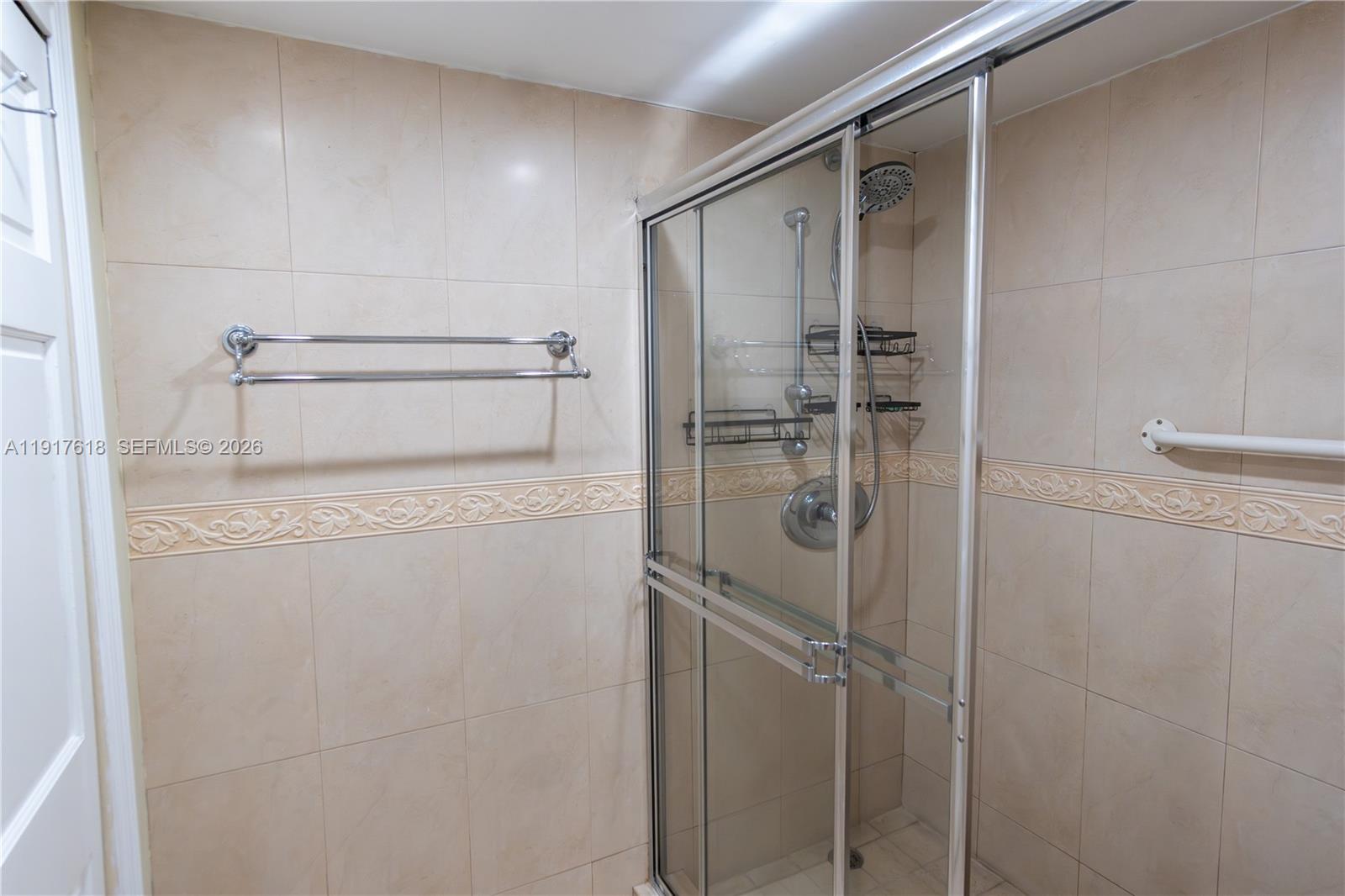 145 Southeast 25th Road, Unit 1003 Miami, FL 33129 - Photo 28 of 43 a bathroom with a shower and toilet