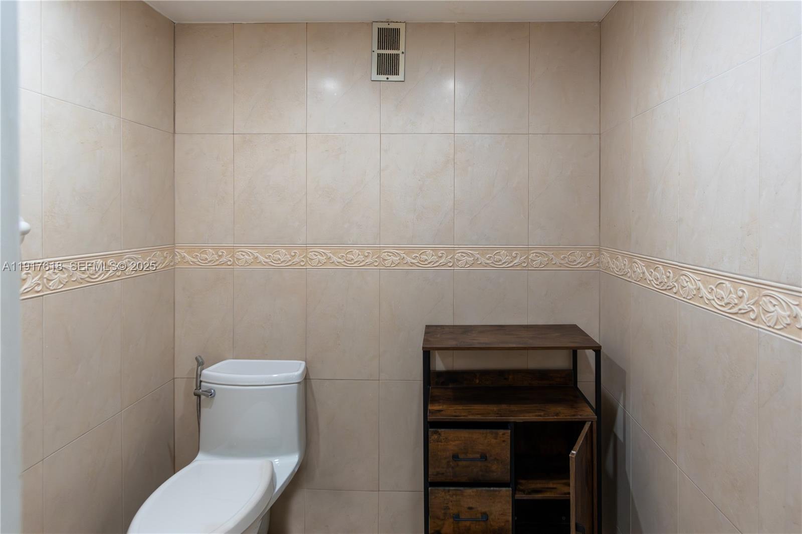 145 Southeast 25th Road, Unit 1003 Miami, FL 33129 - Photo 29 of 43 a bathroom with a toilet and a sink