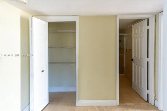 a bathroom with a granite countertop sink a toilet a mirror and shower