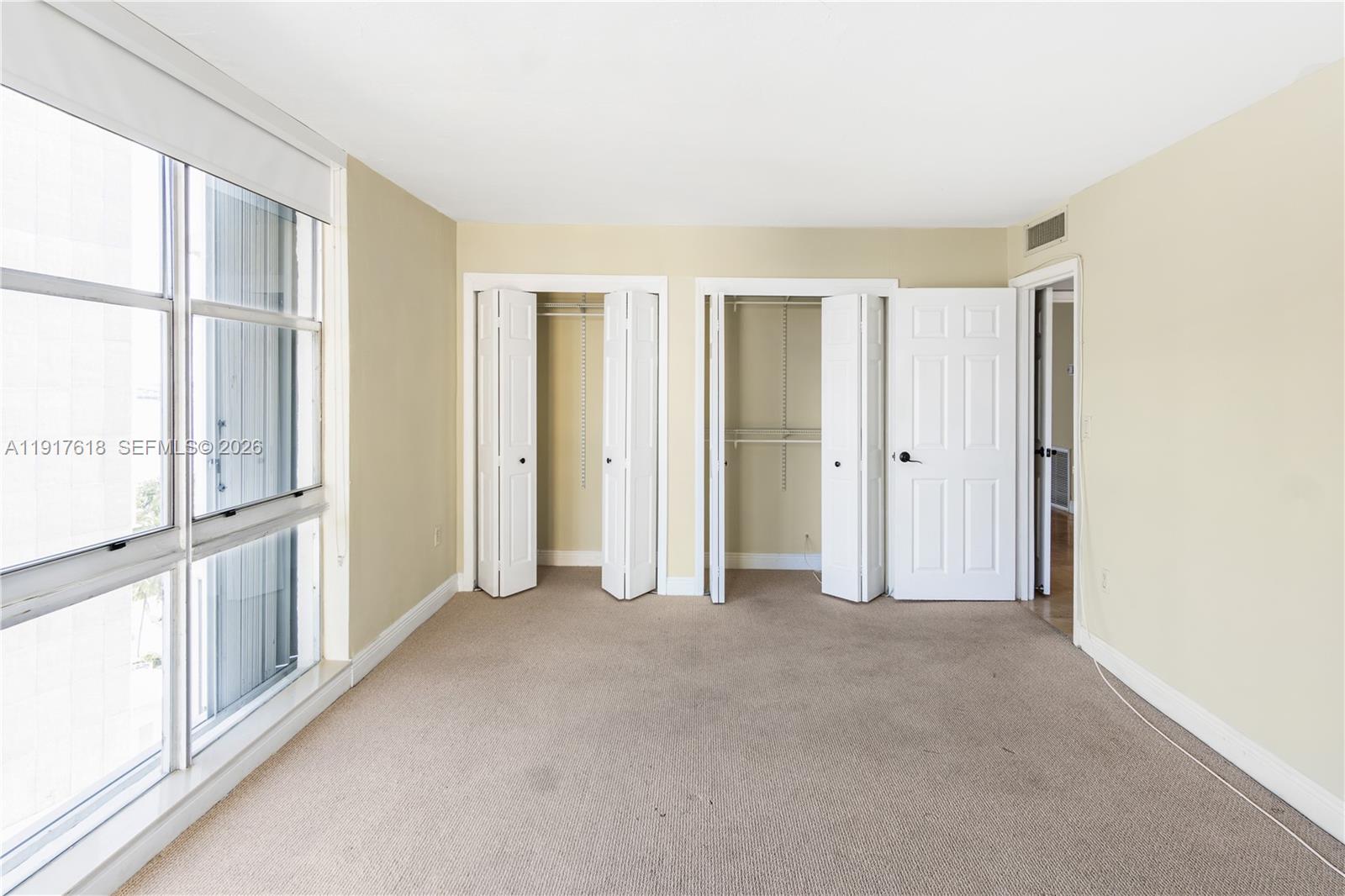 145 Southeast 25th Road, Unit 1003 Miami, FL 33129 - Photo 37 of 43 an empty room with windows