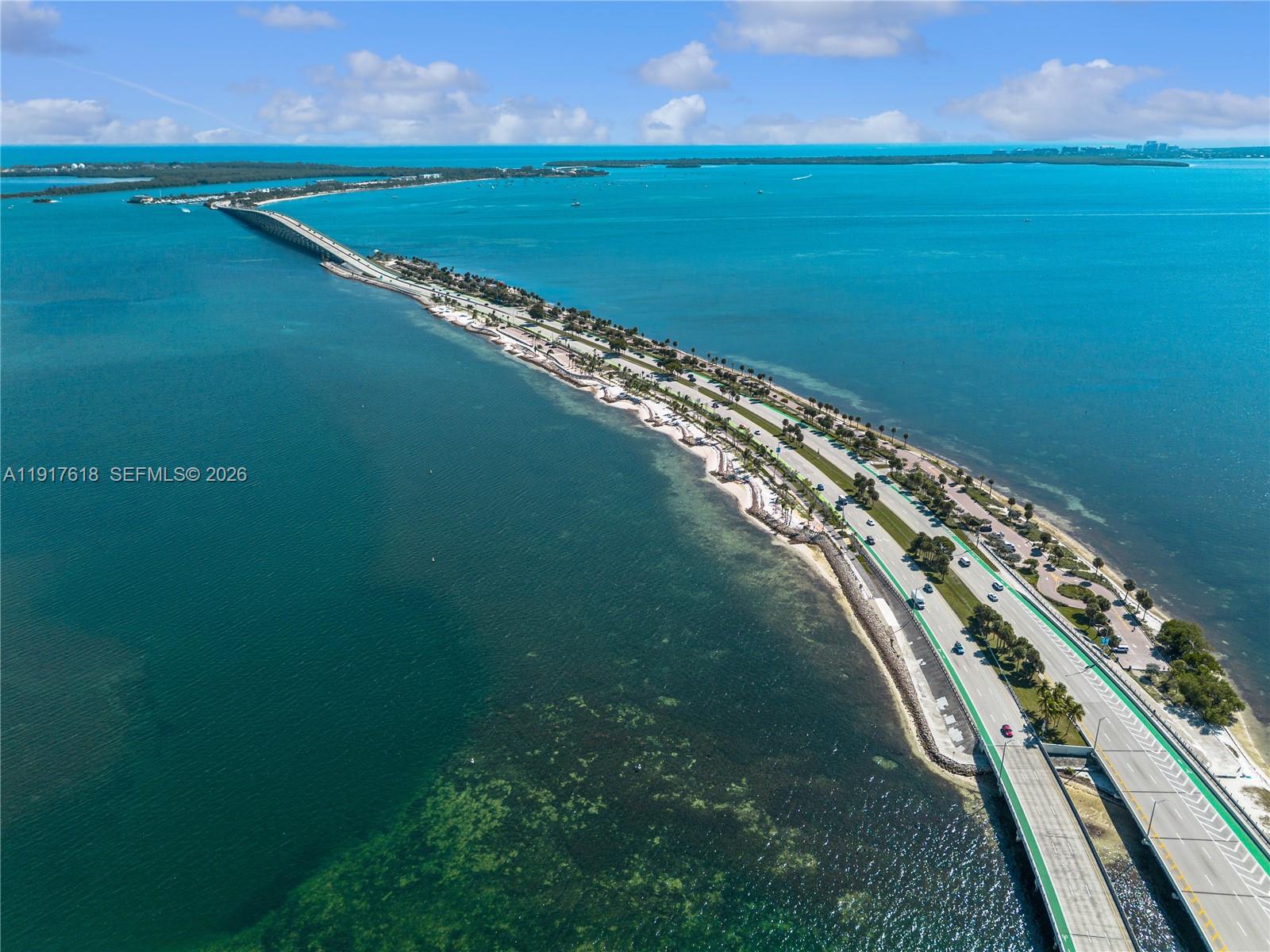 145 Southeast 25th Road, Unit 1003 Miami, FL 33129 - Photo 39 of 43 a view of a lake with a big yard