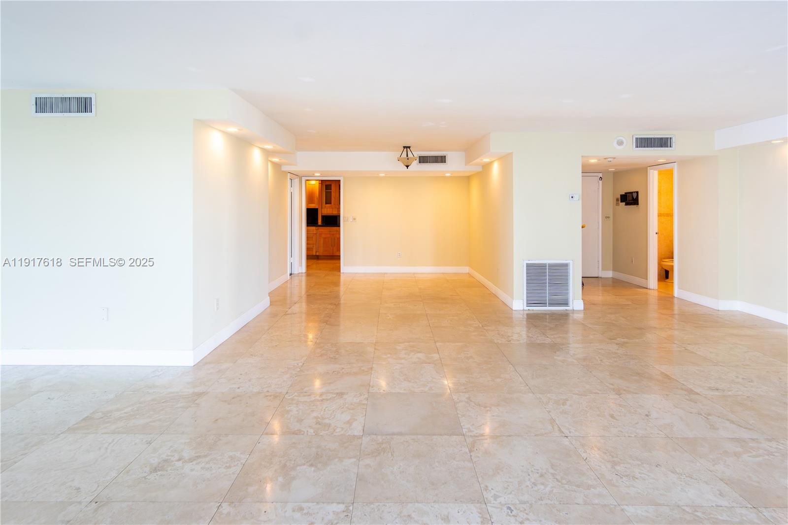 145 Southeast 25th Road, Unit 1003 Miami, FL 33129 - Photo 4 of 43 a view of a hallway with wooden floor