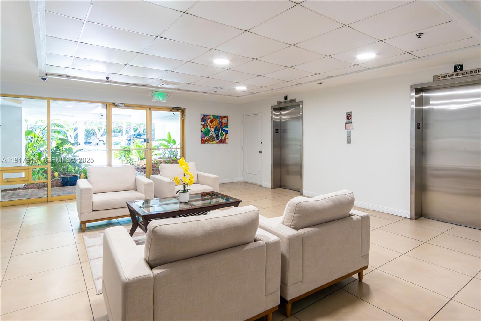 145 Southeast 25th Road, Unit 1003 Miami, FL 33129 - Photo 41 of 43 a living room with furniture and a large window