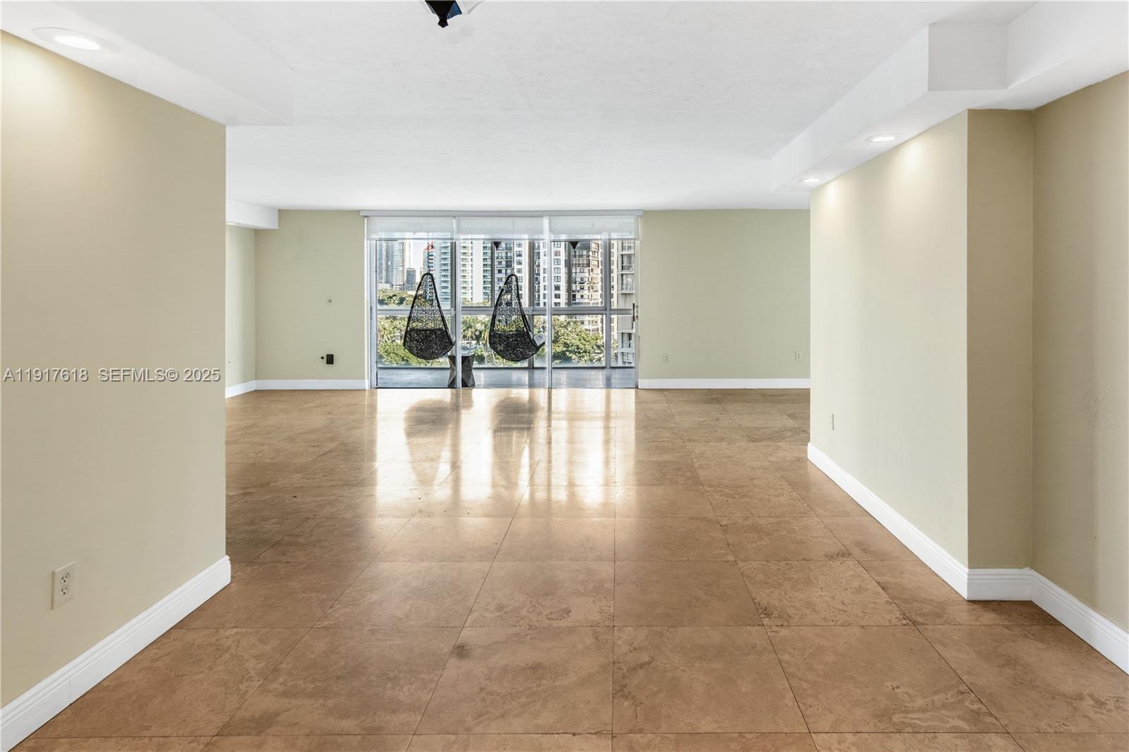 145 Southeast 25th Road, Unit 1003 Miami, FL 33129 - Photo 5 of 43 a view of an empty room with wooden floor