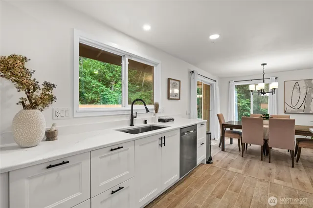 a kitchen with sink and window