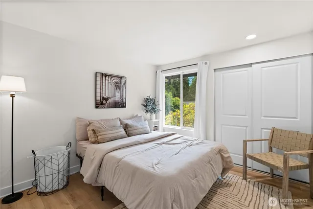 a bedroom with a bed and a table