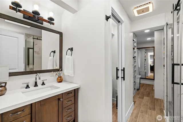 a bathroom with a sink double vanity and a mirror