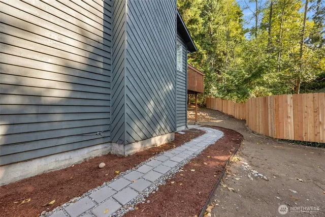 a view of a backyard with a tree