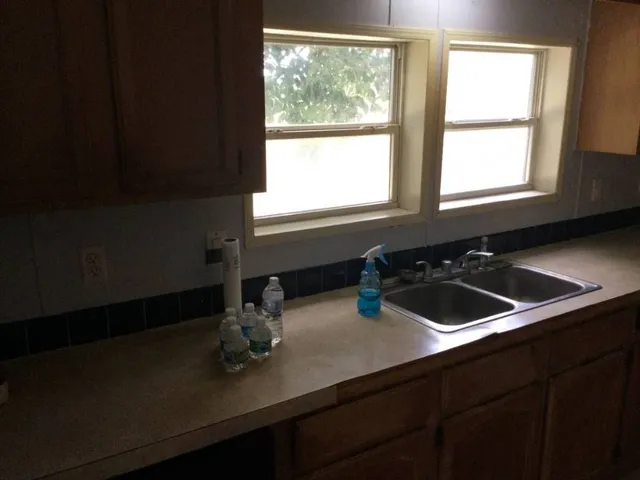 a kitchen with stainless steel appliances a refrigerator and a stove