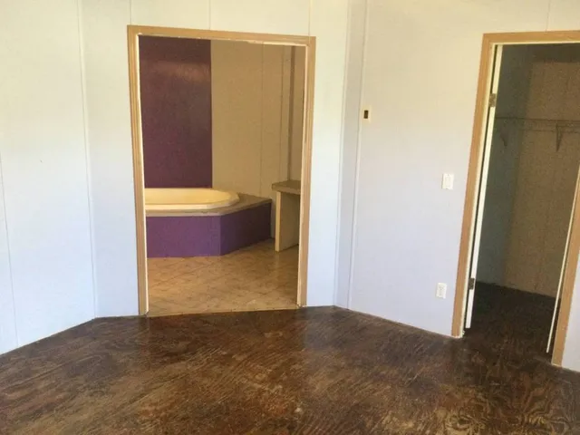 a living room with furniture wooden floor and a fireplace